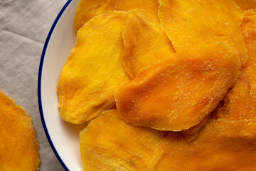 Organic Dried Mangos on a Plate, top view.