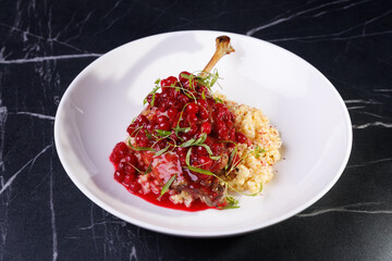 Gourmet Lamb Shank With Cranberry Sauce On Creamy Risotto
