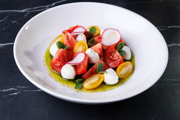 Colorful Tomato Burrata Salad With Radish, Olives, And Fresh Herbs