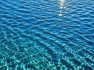 Sparkling Blue Water: Sunlit Pool Surface Texture - Refreshing Summer Vibes and Tranquil Aquatic Reflections