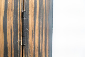 Obraz premium Close-Up of Wooden Door Hinge Detail