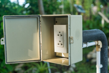 Outdoor Electrical Outlet in Garden Setting