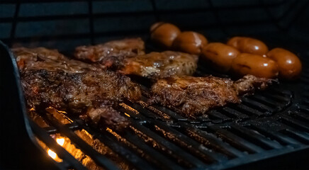 Grilled Meat and Sausages on Hot Barbecue Grill
