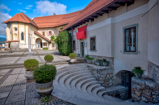 Lake Bled, Slovenia &ndash; July 22, 2025: Cobblestone courtyard and traditional buildings within the historic Bled Castle overlooking the lake.
