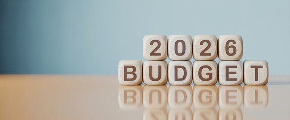 Wooden toy cubes forming the text "2026 BUDGET". Concept for planning the yearly budget for 2026.
