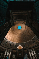 Extreme wide-angle interior shot of the Pantheon dome and oculus, showing the massive structural elements and lower walls. © Darien