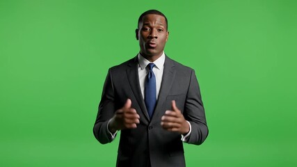 Engaging black male presenter delivering business presentation in front of green screen with confidence and professionalism for corporate communications use - Powered by Adobe