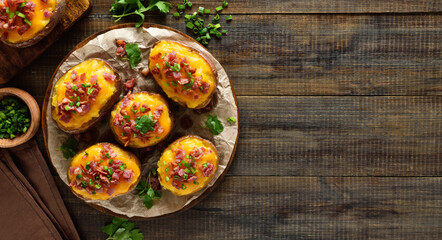 Baked stuffed potatoes with bacon, green onion and cheddar cheese