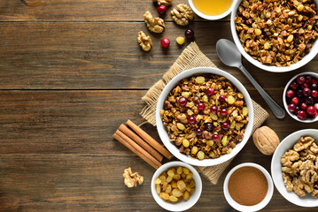 Granola in bowl over wooden background
