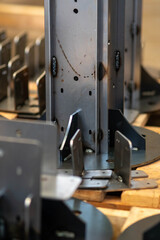 Welded metal structures and supports for a wooden house