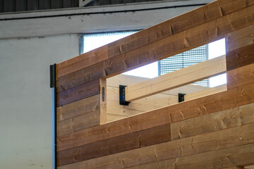 Assembling a wooden house, Swiss style