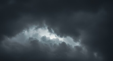 Dramatic overcast sky with dark, textured clouds creating a moody and foreboding atmosphere