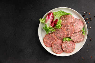 Sausage with garlic and spices slices of salami meat tasty snack fresh gourmet food background on the table rustic food top view copy space