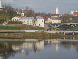 Town with a river running through it and a bridge