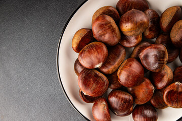 Edible chestnuts delicious treat tasty snack fresh gourmet food background on table rustic food top view copy space