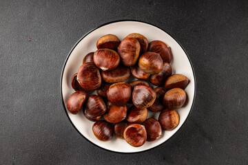 Edible chestnuts delicious treat tasty snack fresh gourmet food background on table rustic food top view copy space