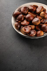 Edible chestnuts delicious treat tasty snack fresh gourmet food background on table rustic food top view copy space