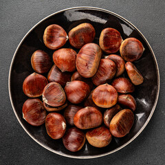 Obraz premium Edible chestnuts delicious treat tasty snack fresh gourmet food background on table rustic food top view copy space