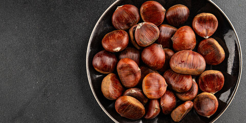 Obraz premium Edible chestnuts delicious treat tasty snack fresh gourmet food background on table rustic food top view copy space