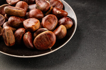 Edible chestnuts delicious treat tasty snack fresh gourmet food background on table rustic food top view copy space