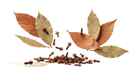 Spice Symphony A close-up shot of bay leaves and cloves on a white background, perfect for culinary use