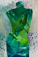 Body form of sculpted wicker mannequin shows curves & mid section of female woman     embellished with fabric, design, bubbles or  butterfly. Body is in movement. with bubbles.