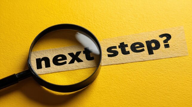 High resolution photo of magnifying glass finds "next step?" query. Search loupe over inquiry sign seeks answer. Finding solution, progress concept. Future steps research, strategy in.