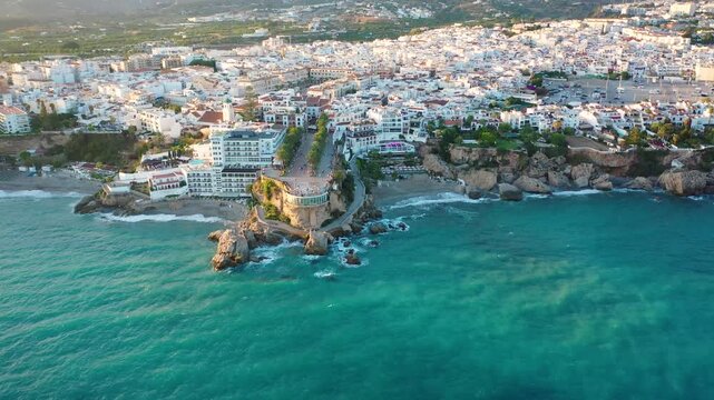Aerial 4K video from drone to Balcony of Europe in Nerja resort town on Costa del Sol Mediterranean sea coast at sunsetin Andalusia, Spain. 