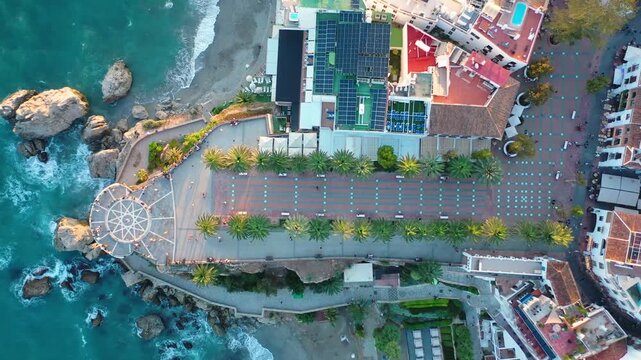 Aerial 4K video from drone to Balcony of Europe in Nerja resort town on Costa del Sol Mediterranean sea coast at sunsetin Andalusia, Spain. 