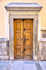 Ljubljana, Slovenia – July 14, 2025: Close-up of a weathered stone wall above a window frame in Ljubljana, Slovenia, showing the texture and layers of old masonry construction.
