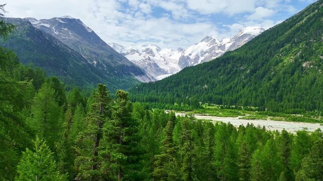 red swiss train on Landwasser viaduct bridge in Swiss Alps. Zermatt to St. Moritz.  scenic railway. Switzerland summer tourism.