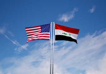 flags of iraq and United States of America over blue sky background.