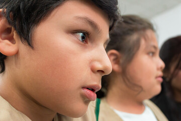 Portrait of a Latino child expressing amazement during a science and technology fair in Neiva, Huila, Colombia. Concept of Colombian people
