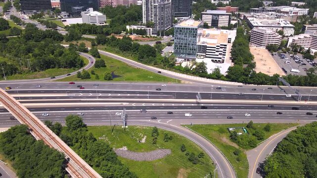 Skyscrapers and freeways in a busy urban landscape. Transportation highways combine with business architecture in a dynamic landscape.
