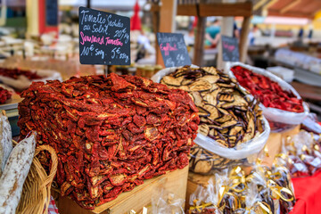Sun dried tomatoes at a vegetable stand at the farmers market in Nice, France