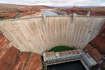 Upstream face of Glen Canyon Dam viewed from Glen Canyon Bridge, overlooking the Colorado River in...