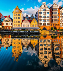 Old houses and street in Gdansk on the Motlawa river
