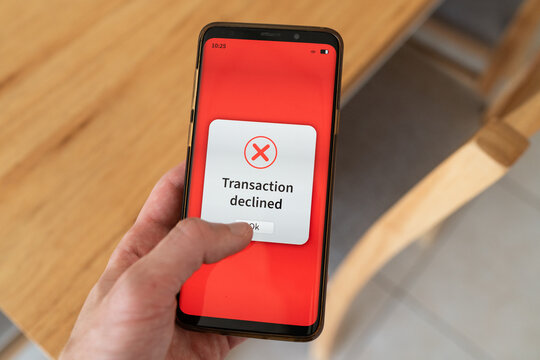 Transaction declined by payment processor message on phone screen.
