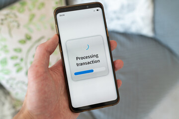 Processing transaction message on smartphone screen.