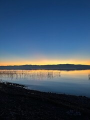 Golden waves shimmer beneath twilight