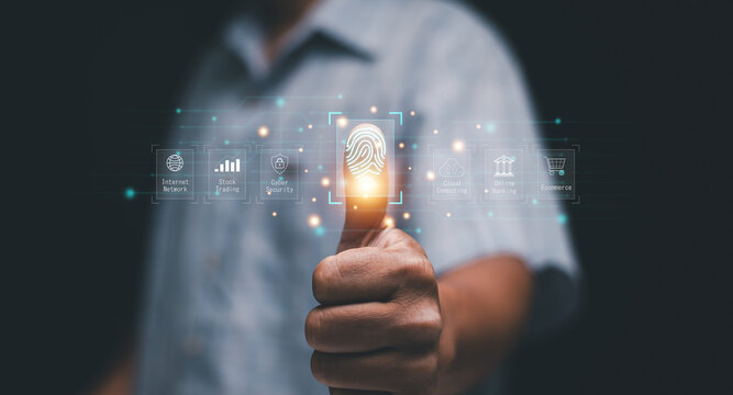 Biometric fingerprint authentication concept. Man use thumb print scan for online login. Cybersecurity, data protection, secure access, online banking, ecommerce and modern identity technology.