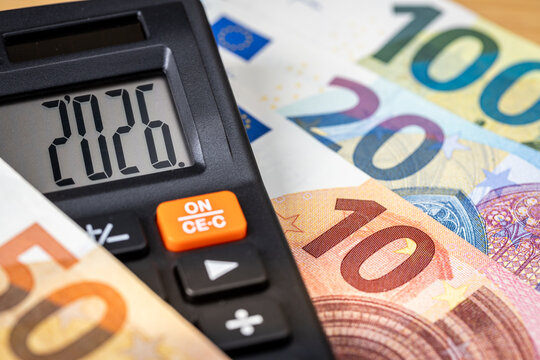 Eurozone 2026 year. Financial business concept. Money and calculator with date 2026. Market analysis. Euro currency.  exchange rate. Economic background. closeup