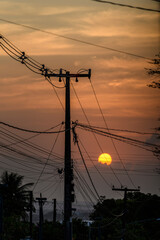 Sunset Behind Power Lines and Utility Poles