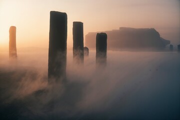 Pillars in fog at dawn