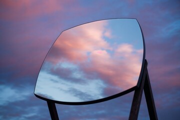 Mirror reflecting the sky view