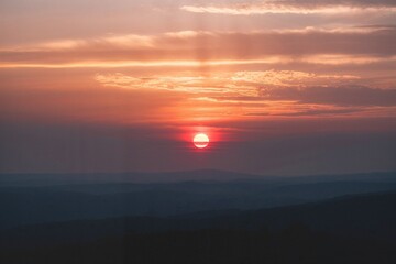 Sun setting over the horizon