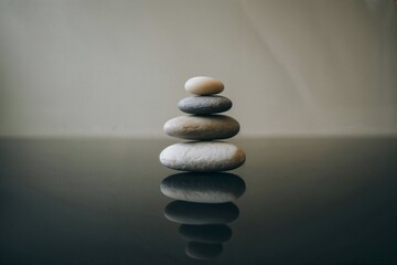 Stack of stones on dark surface