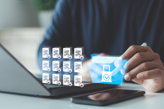 Secure document, data management concept. Businessman using laptop and tablet. Locked digital folder and documents represent cyber security, file protection, privacy policy, safe information storage.