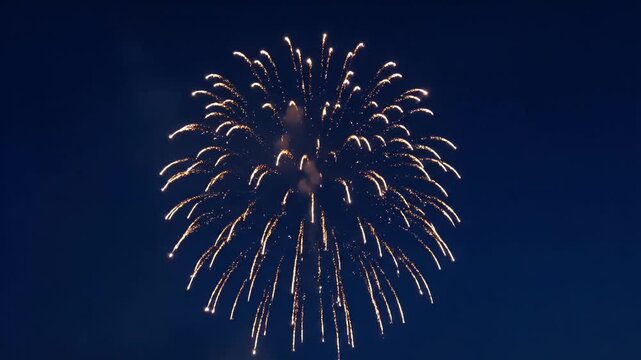 Golden fireworks explosion bursting brightly against a dark night sky perfect for festive celebrations holiday displays and spectacular event backdrops