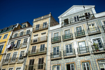 View of a typical facades or a row of historic tiled buildings in Lisbon, Portugal